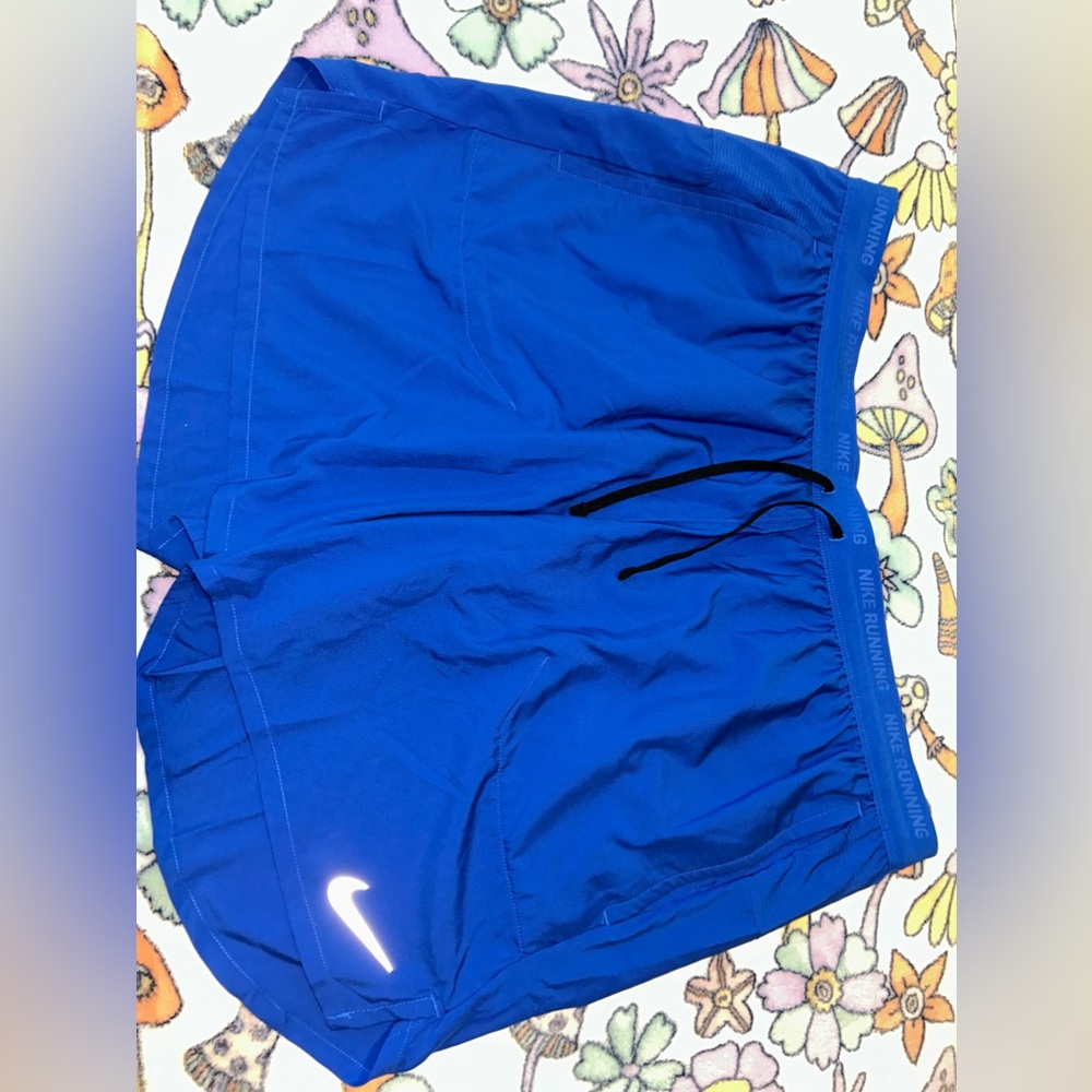Blue Nike dri-fit running shorts